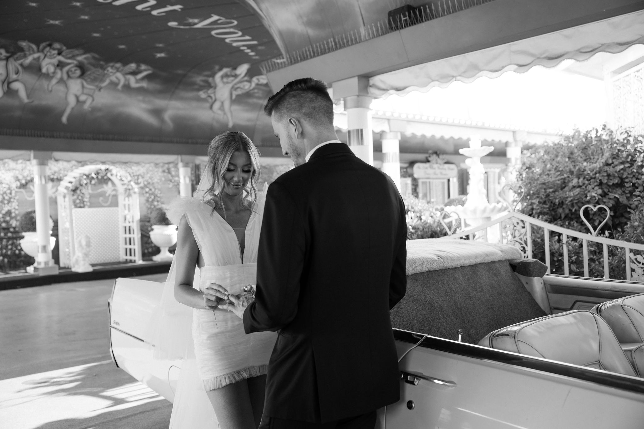 An intimate wedding  Pink Cadillac wedding ceremony at The Little White Chapel