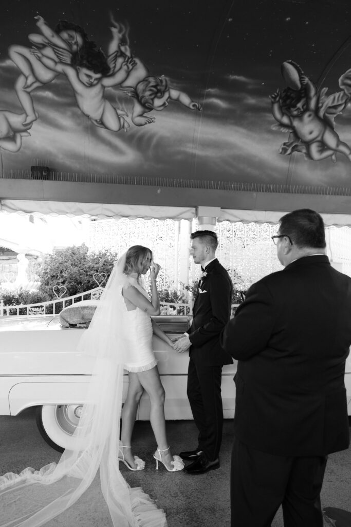 An intimate wedding  Pink Cadillac wedding ceremony at The Little White Chapel