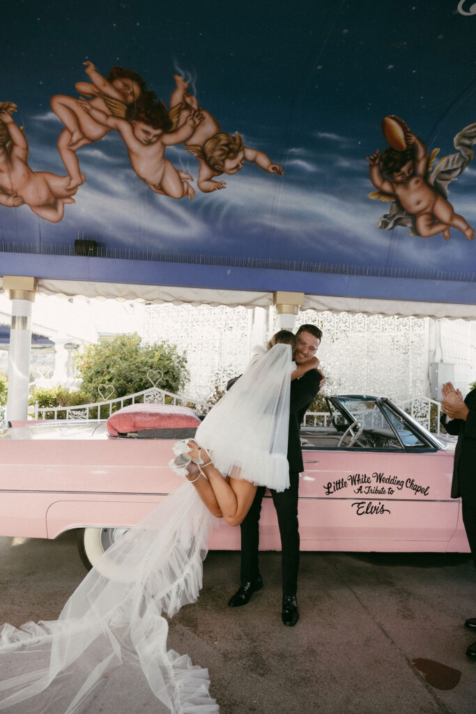 An intimate wedding  Pink Cadillac wedding ceremony at The Little White Chapel