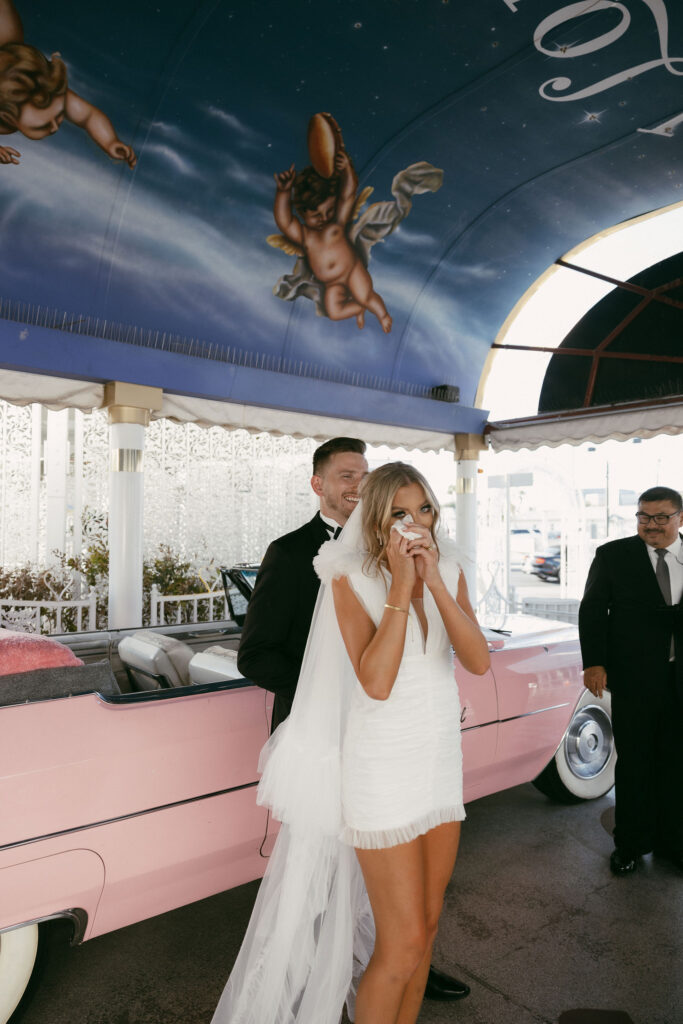 An intimate wedding  Pink Cadillac wedding ceremony at The Little White Chapel