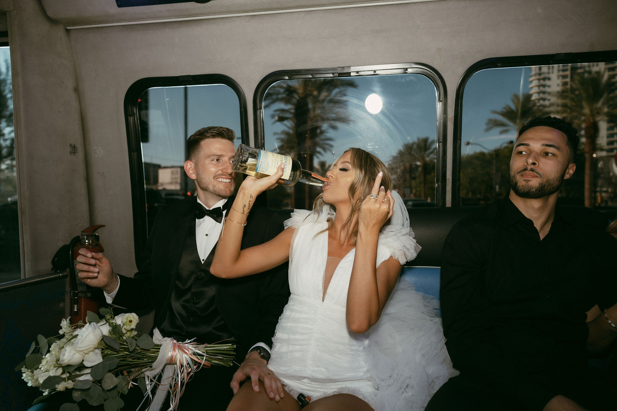 Bride and groom on a party bus after their Las Vegas elopement 