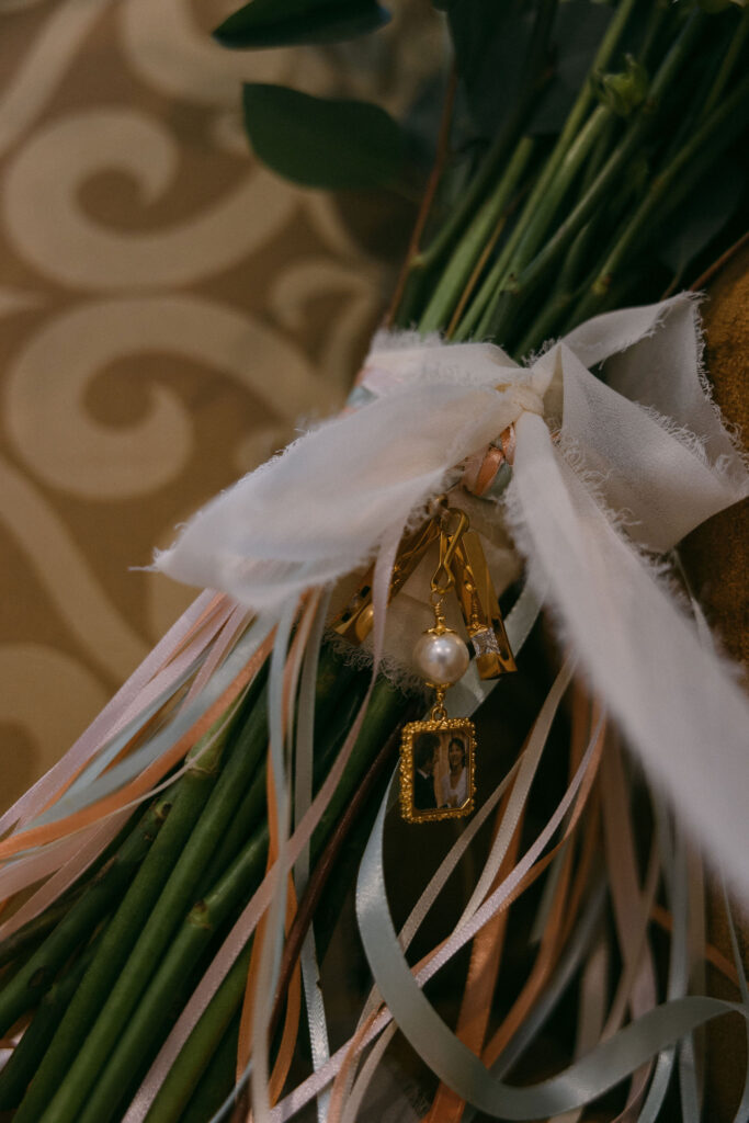 Close up detail shot of wedding bouquet with pendants 