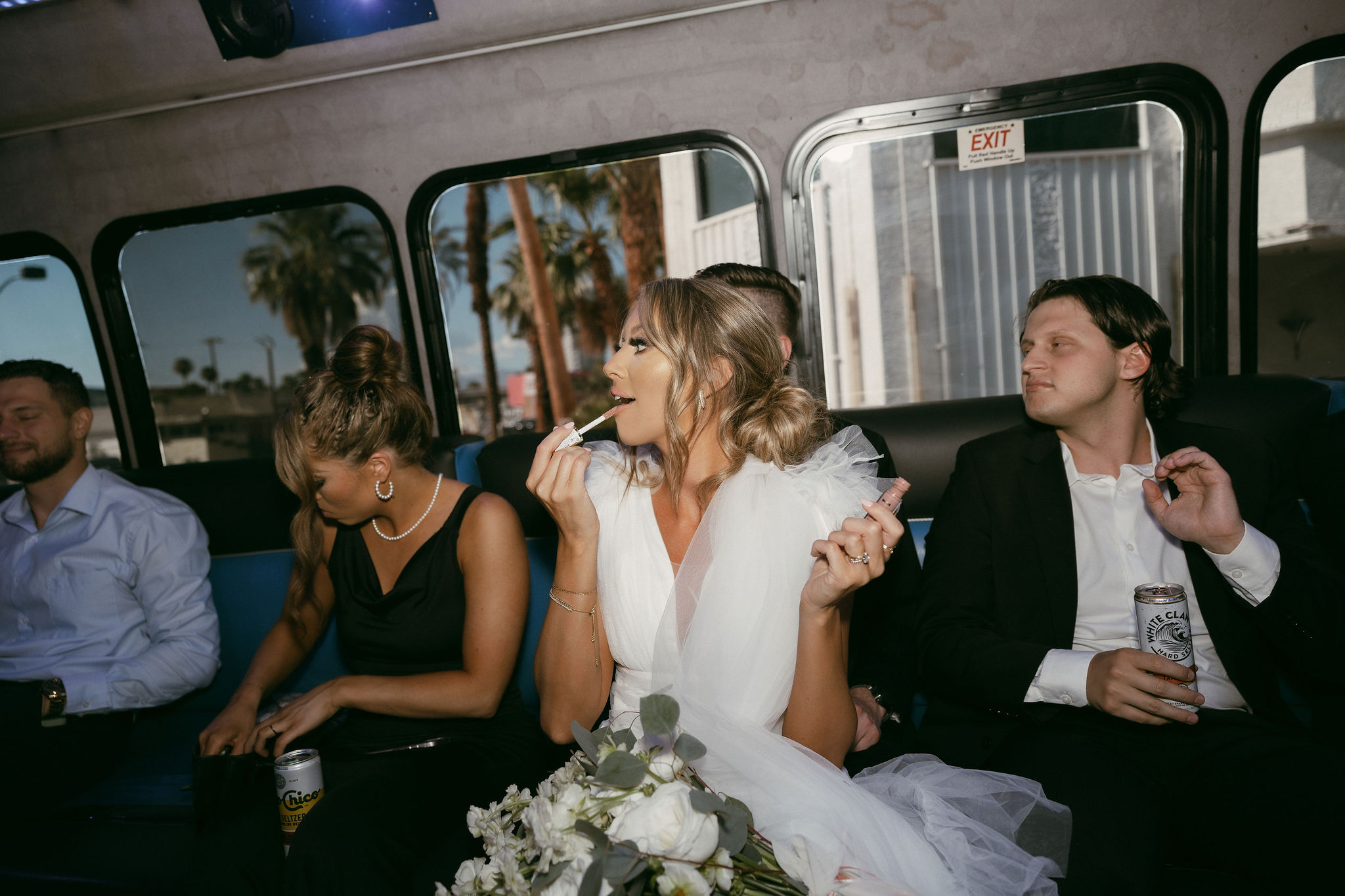 Bride putting her lipstick on