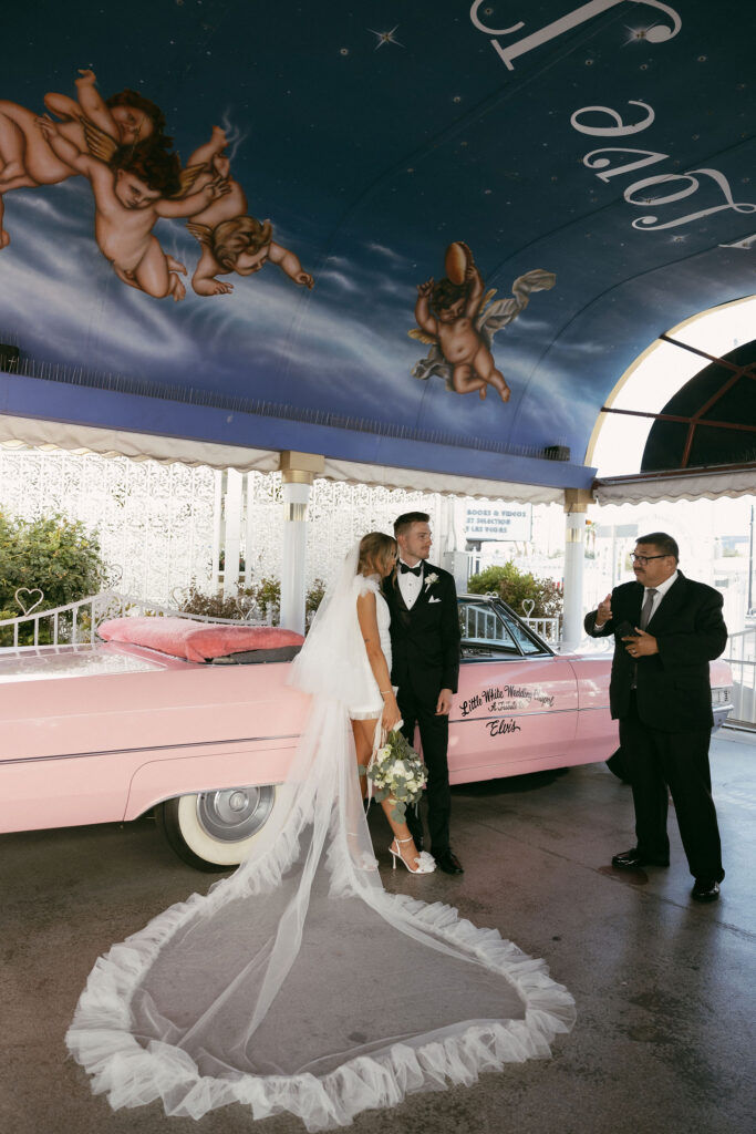 An intimate wedding  Pink Cadillac wedding ceremony at The Little White Chapel