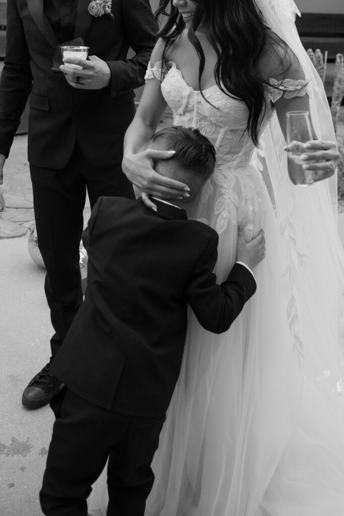 Bride and groom drinking champagne