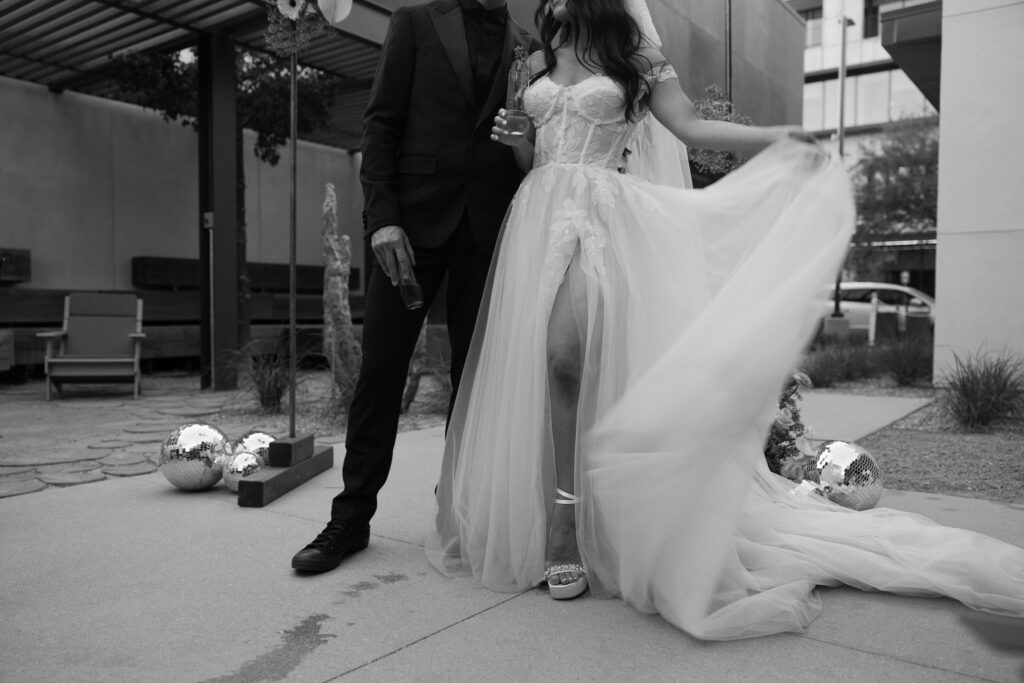 Bride and groom drinking champagne