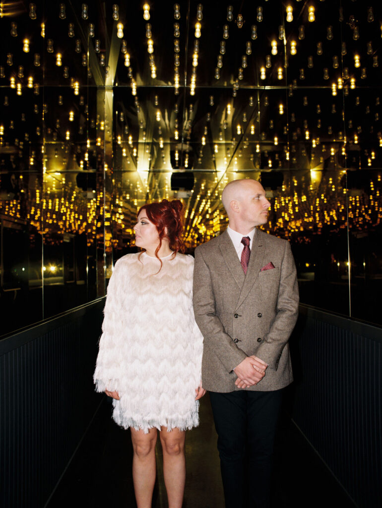 Bride and groom portraits on Fremont Street in Vegas captured on 35mm film