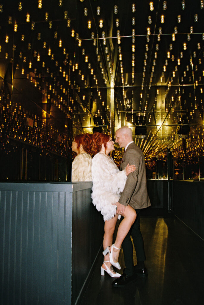 Bride and groom portraits on Fremont Street in Vegas captured on 35mm film