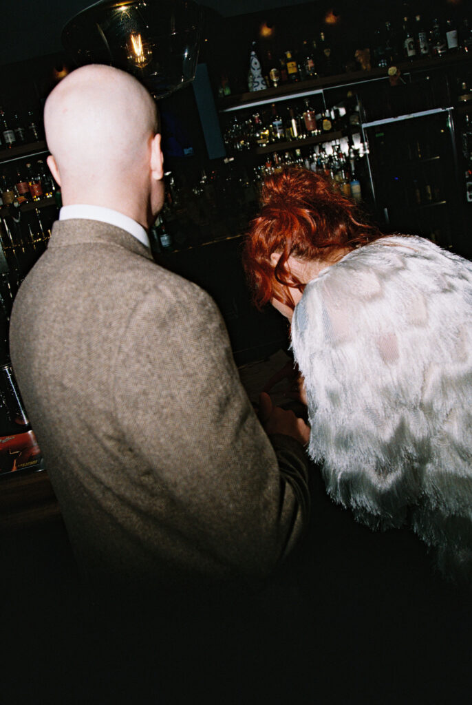 Bride and groom ordering drinks