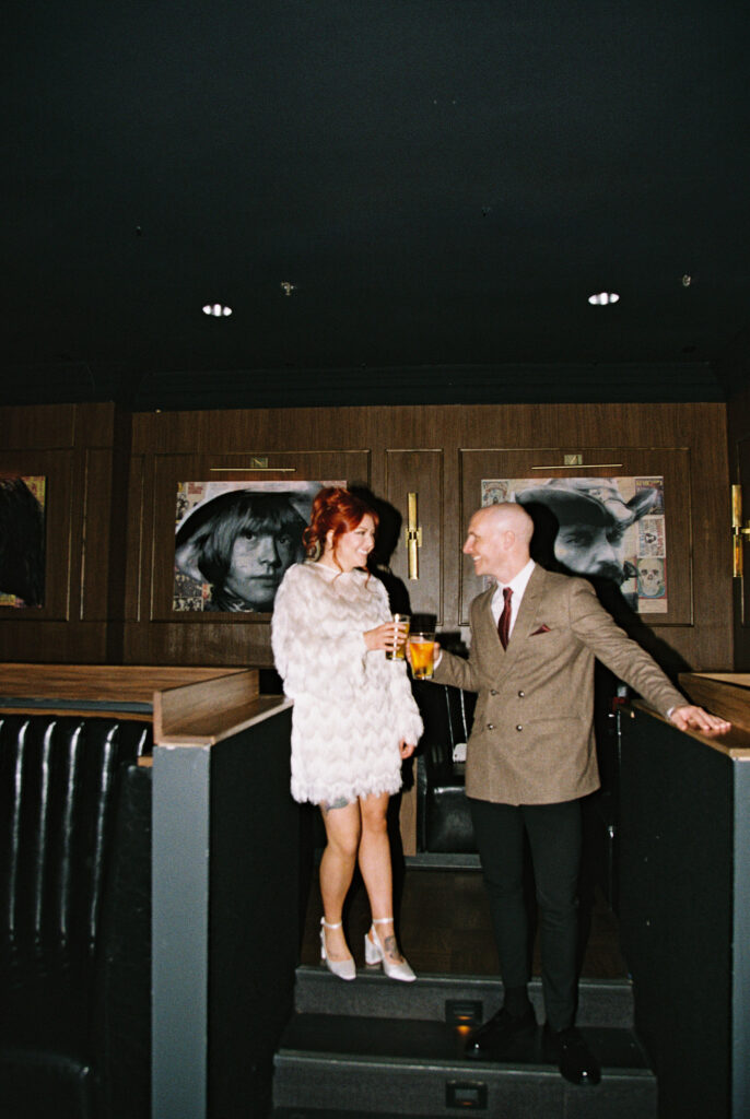 Bride and groom enjoying their drinks together