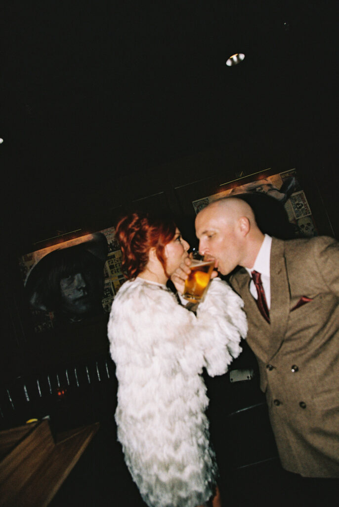 Bride and groom enjoying their drinks together