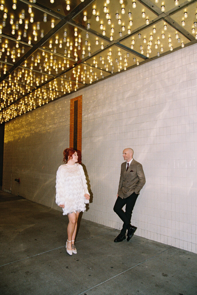 Bride and groom portraits on Fremont Street in Vegas captured on 35mm film