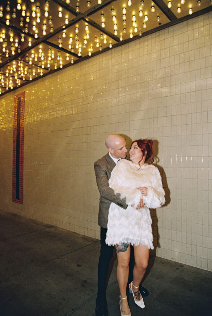 Bride and groom portraits on Fremont Street in Vegas captured on 35mm film