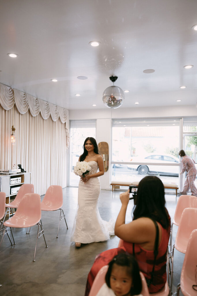 Bride walking down the aisle at Sure Thing Chapel.