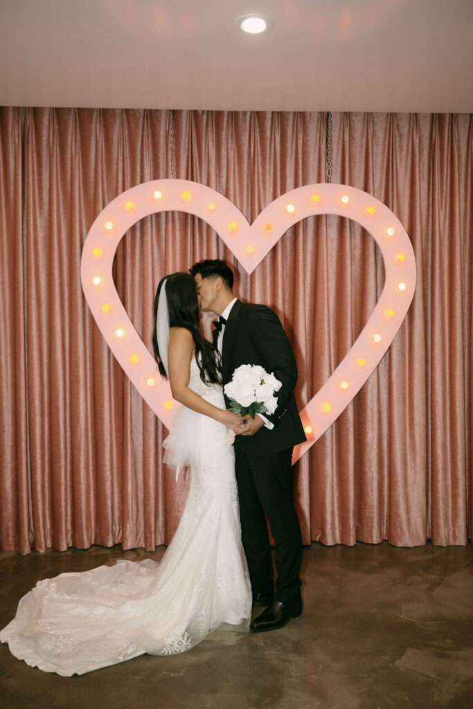 Bride and groom kissing during their Sure Thing Chapel elopement ceremony. 