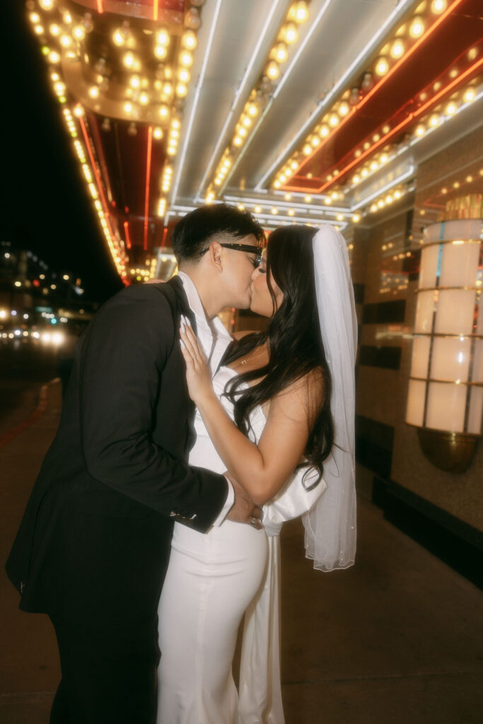 Flash photos of a bride and groom on Fremont Street