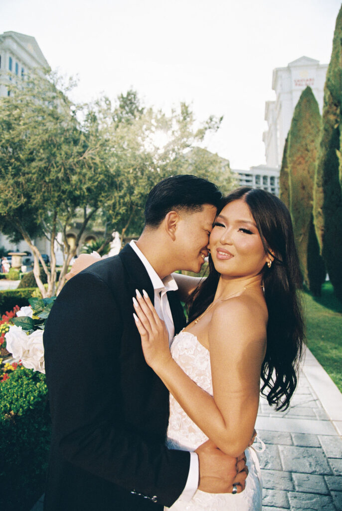 Film elopement photos of a bride and groom at Caesars Palace in Las Vegas. 