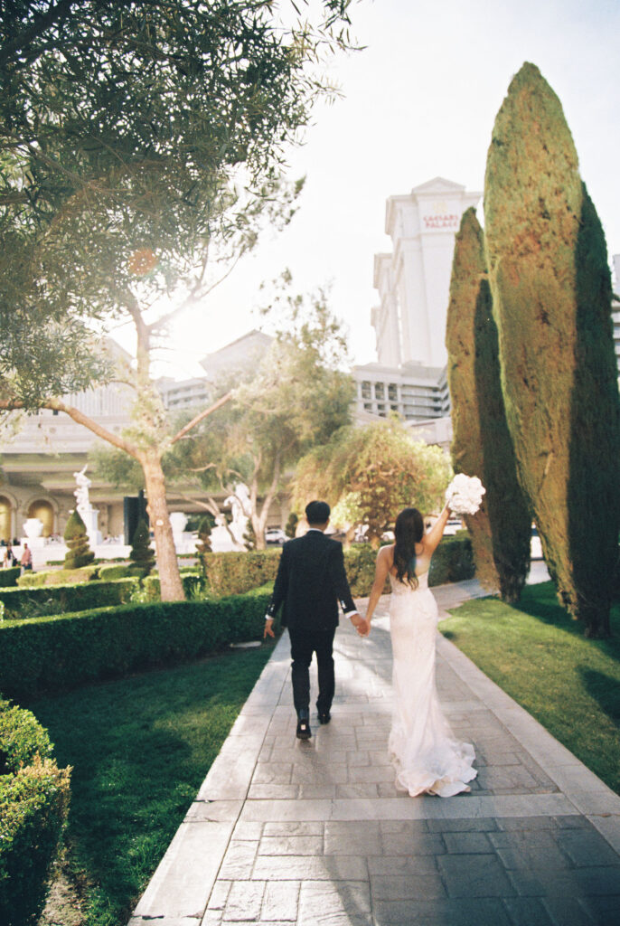 Film elopement photos of a bride and groom at Caesars Palace in Las Vegas. 