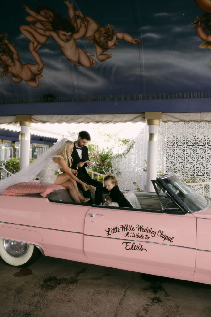 Bride and grooms intimate Little White Chapel Pink Cadillac ceremony