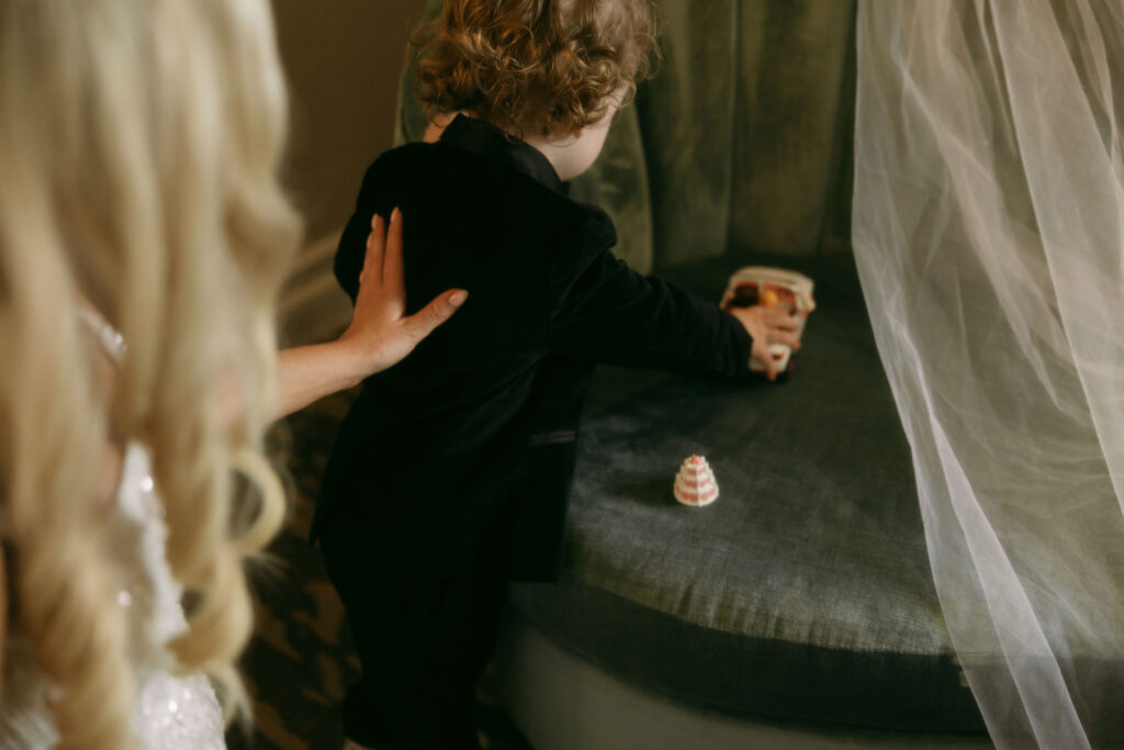 Bride watching her son play as they get ready for their Las Vegas elopement