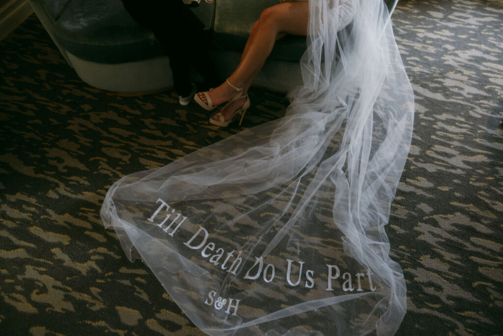 Bride wearing custom "Till Death Do Us Part" veil 