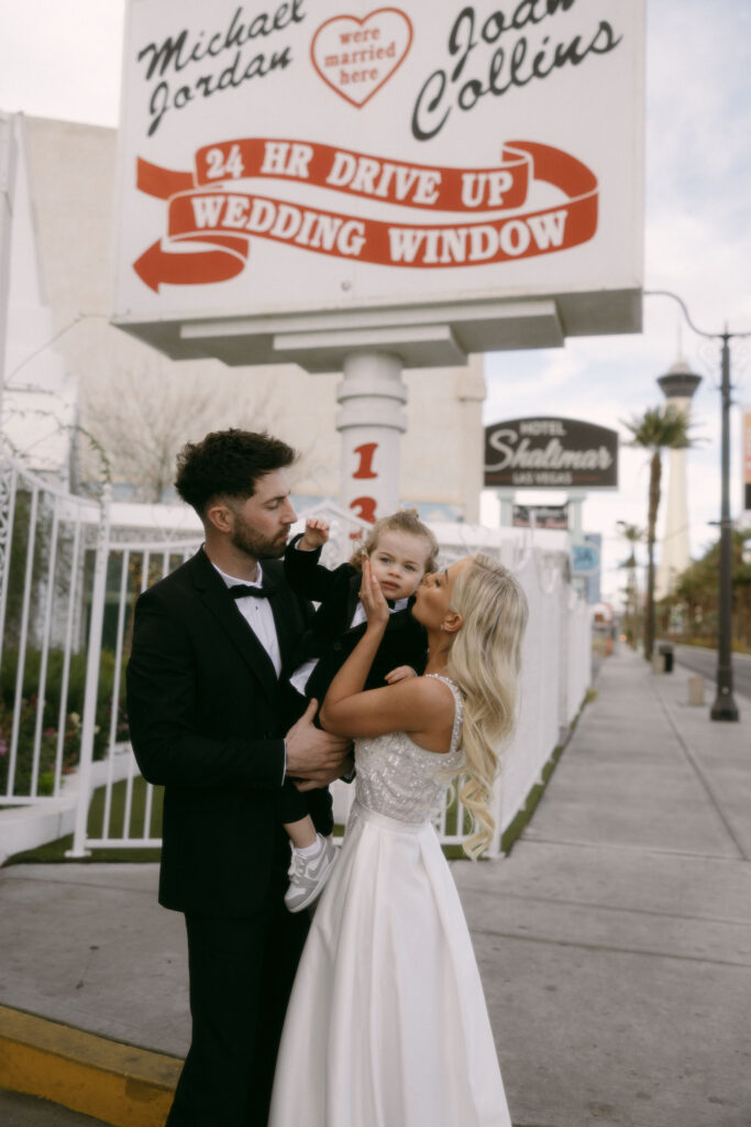 Bride and groom portraits at The Little White Chapel with their toddler son