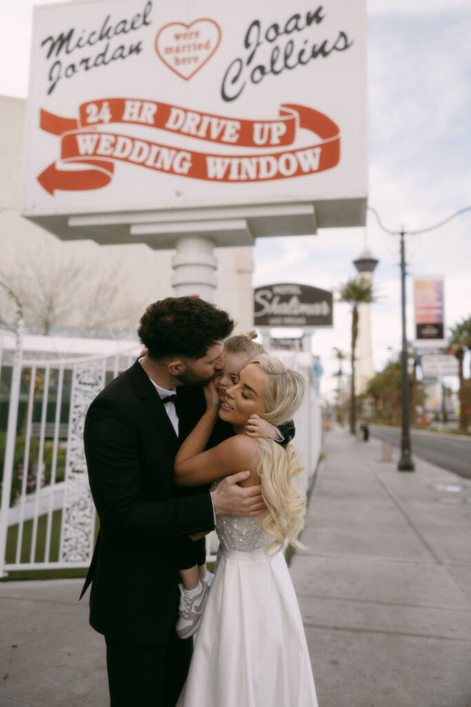 Bride and groom portraits at The Little White Chapel with their toddler son