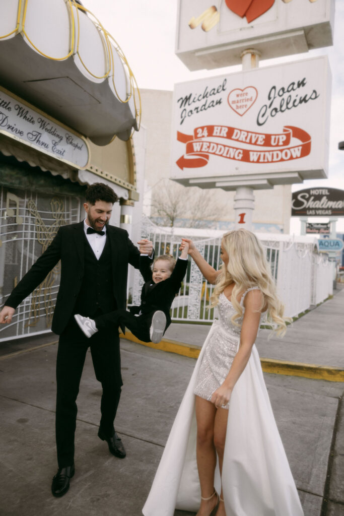 Bride and groom portraits at The Little White Chapel with their toddler son