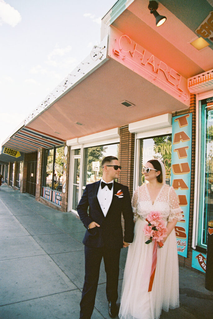 Bride and groom posing outside of Sure Thing Chapel