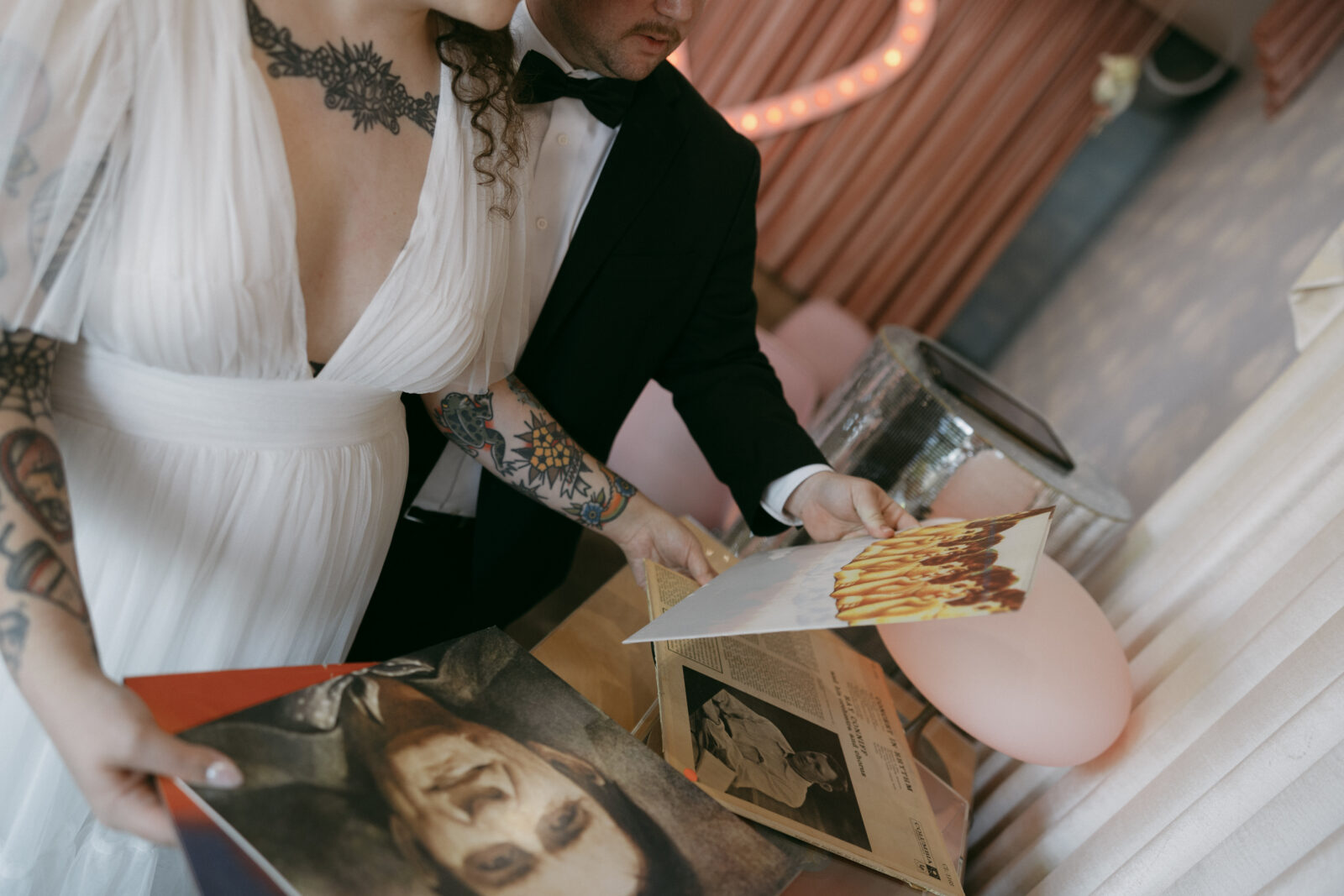 Bride and groom picking out a record at Sure Thing Chapel