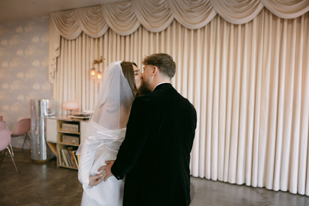 Bride and groom kissing after their Sure Thing Chapel Las Vegas elopement ceremony