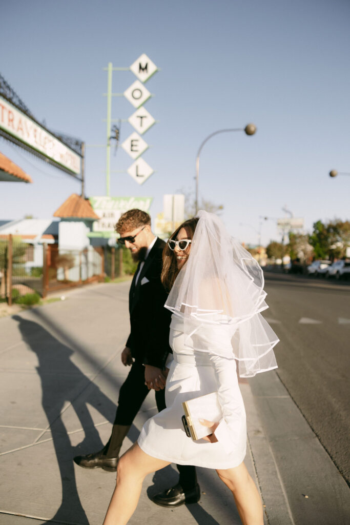 Bride and groom walking in downtown Las Vegas before their elopement