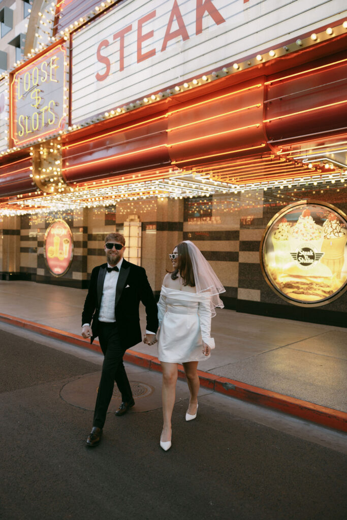 Bride and groom walking in downtown Las Vegas