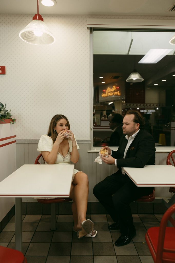 Bide and groom eating in n out after their las vegas elopement