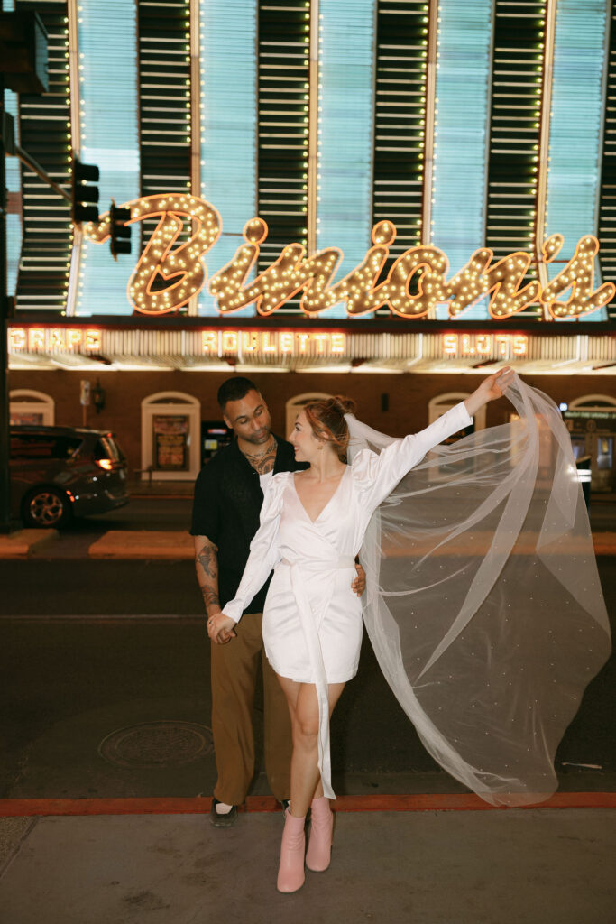 Bride and groom in front of Binion's in Las Vegas for their wedding portraits