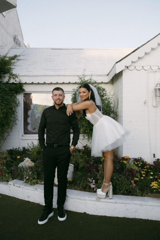 Bride and grooms portraits outside of The Little White Wedding Chapel in Las Vegas