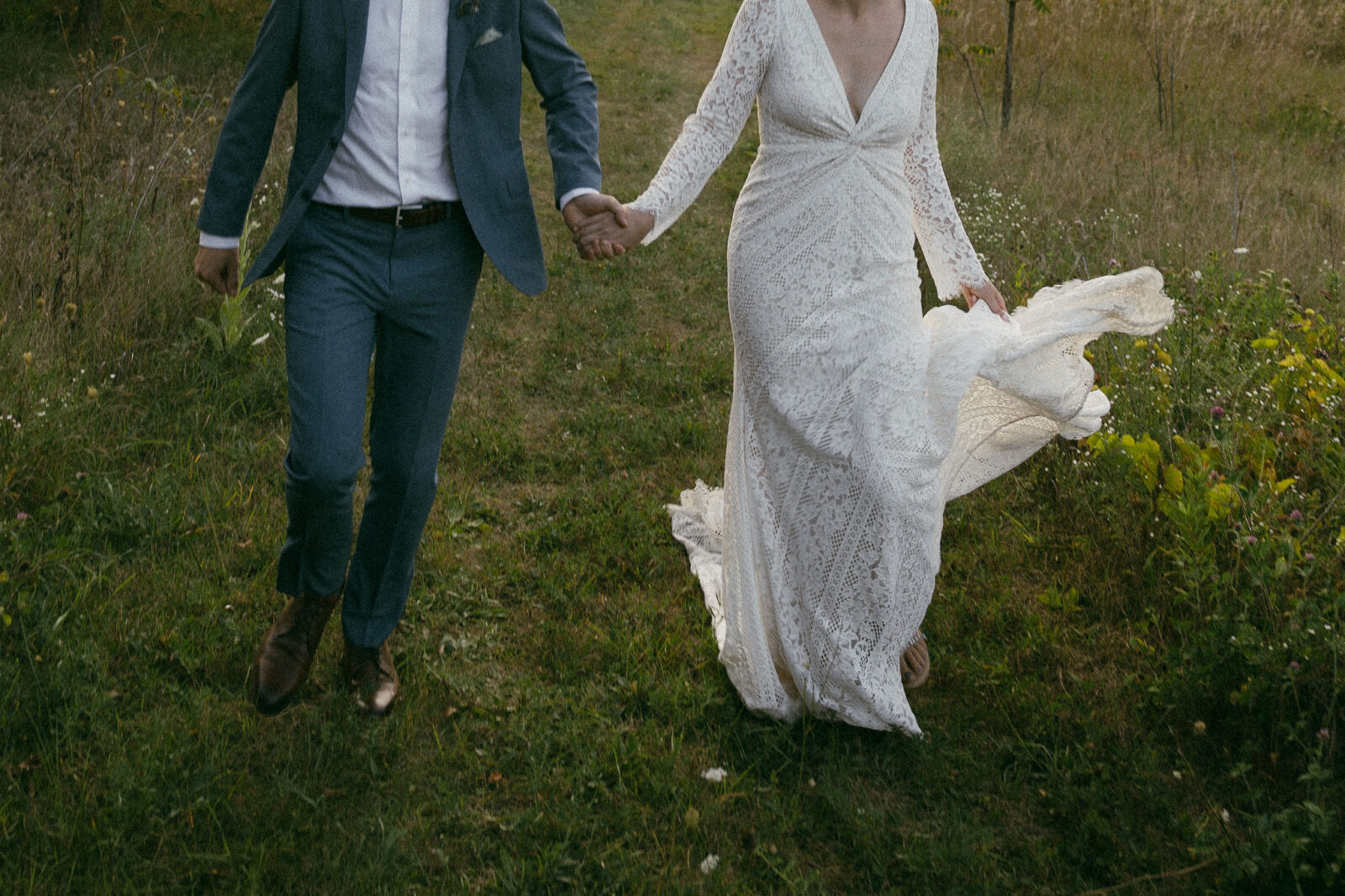 Bride and grooms outdoor sunset wedding portraits during their summer camp wedding in Wisconsin