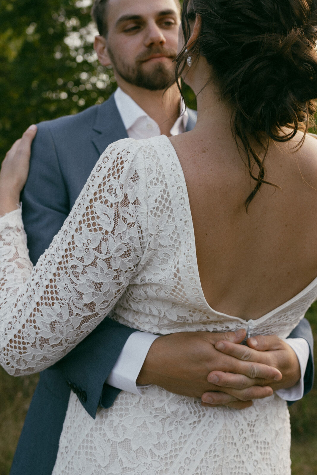 Bride and grooms outdoor sunset wedding portraits during their summer camp wedding in Wisconsin