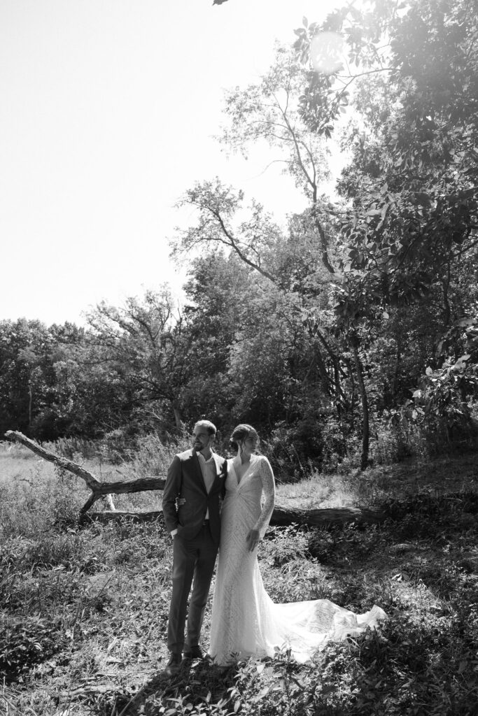 Black and white wedding photo of a bride and groom from their Wisconsin summer camp wedding