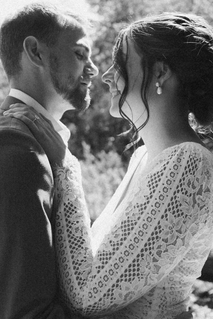 Black and white wedding photo of a bride and groom from their Wisconsin summer camp wedding