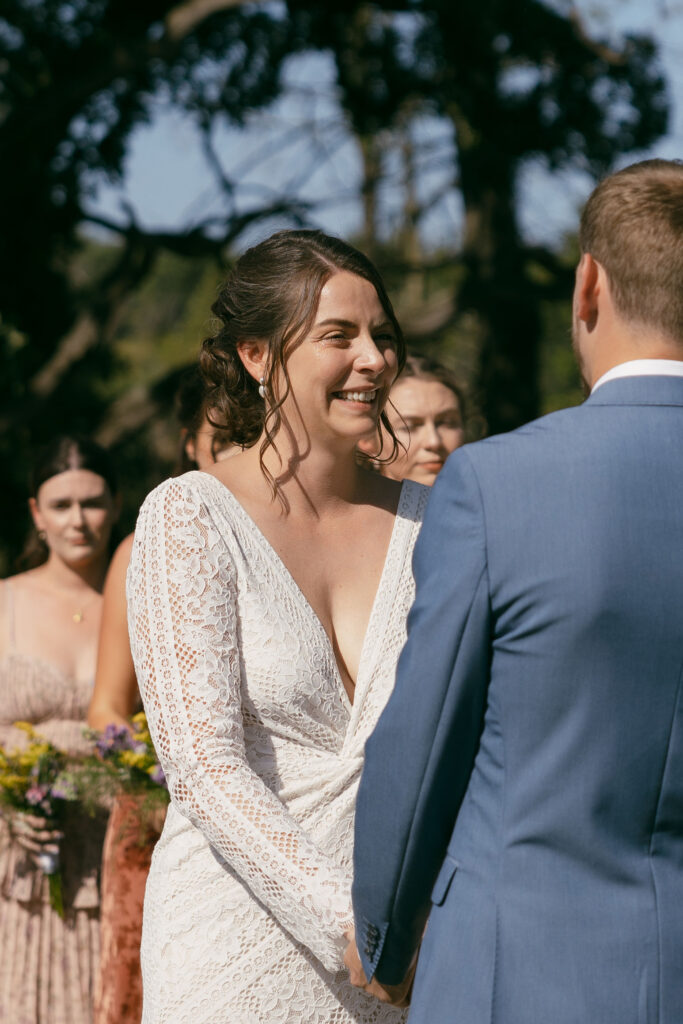 An outdoor summer camp wedding ceremony at Camp Kettlewood in Wisconsin