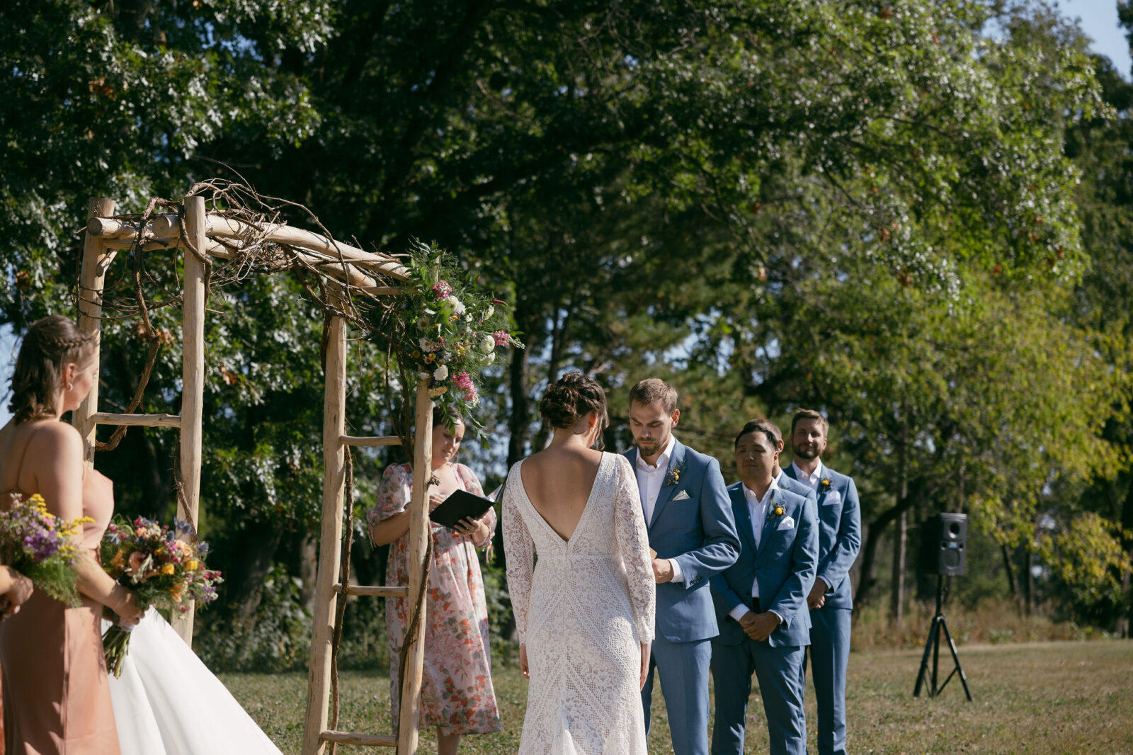 An outdoor summer camp wedding ceremony at Camp Kettlewood in Wisconsin