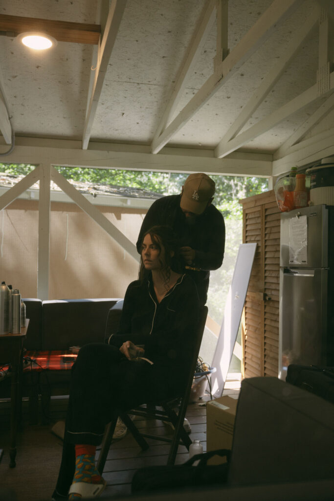 Bride getting her hair and makeup done in her tent