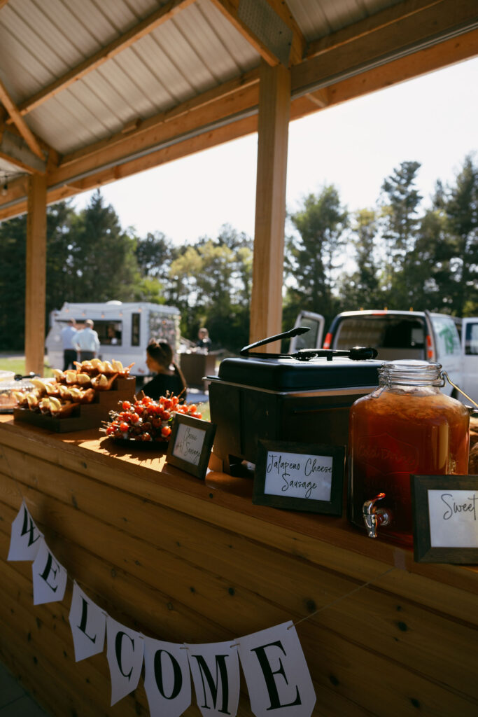 Drinks and food at a summer camp wedding reception