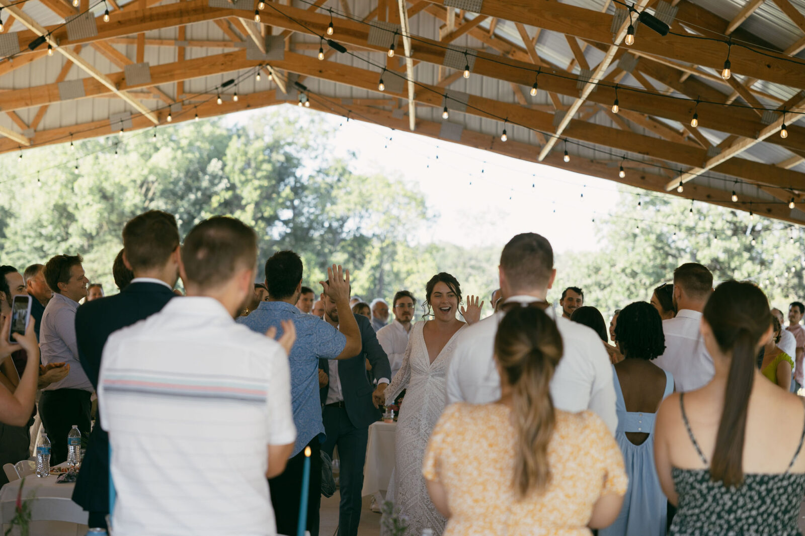 Bride and groom entering their wedding reception