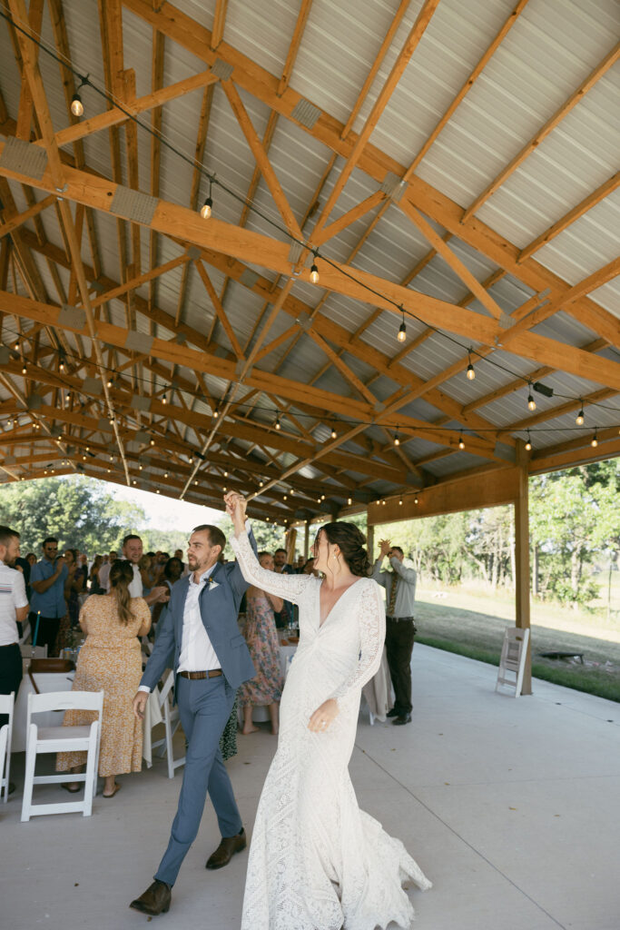 Bride and groom entering their wedding reception