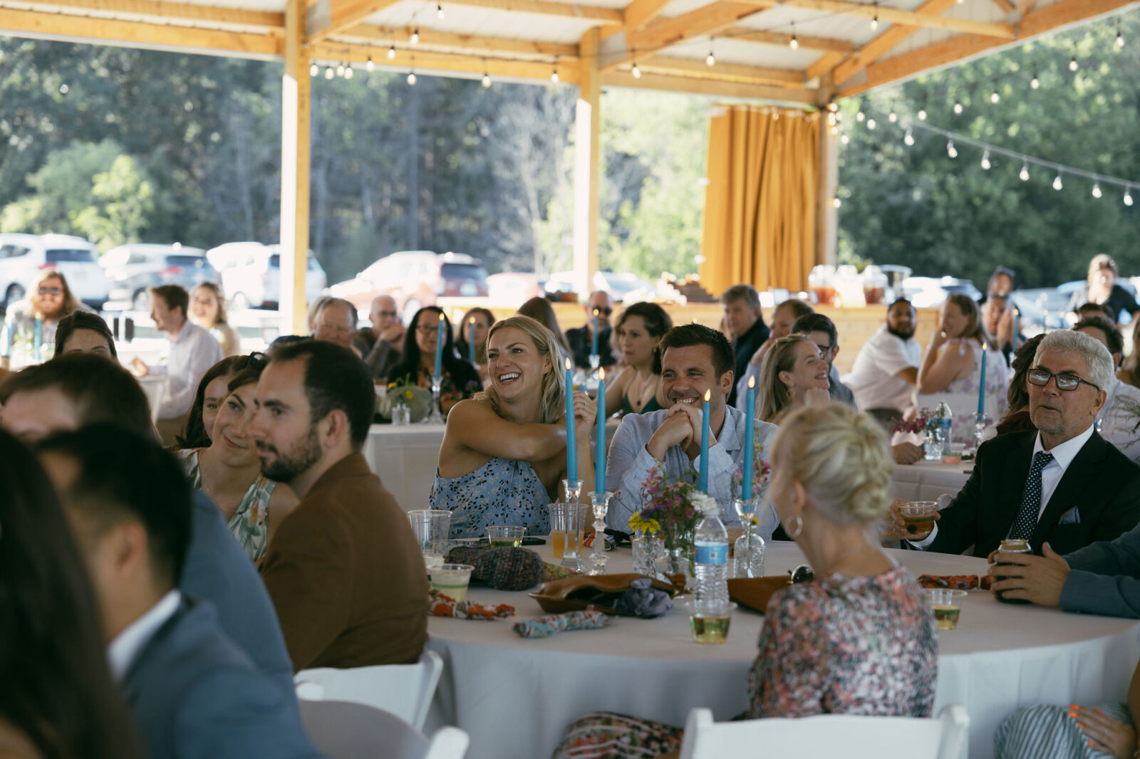 Wedding guests laughing during speeches