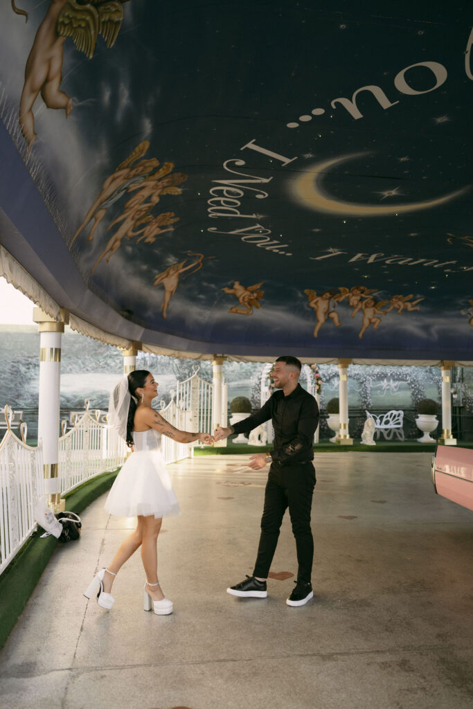 Bride and groom dancing in The Tunnel of Love at The Little White Wedding Chapel