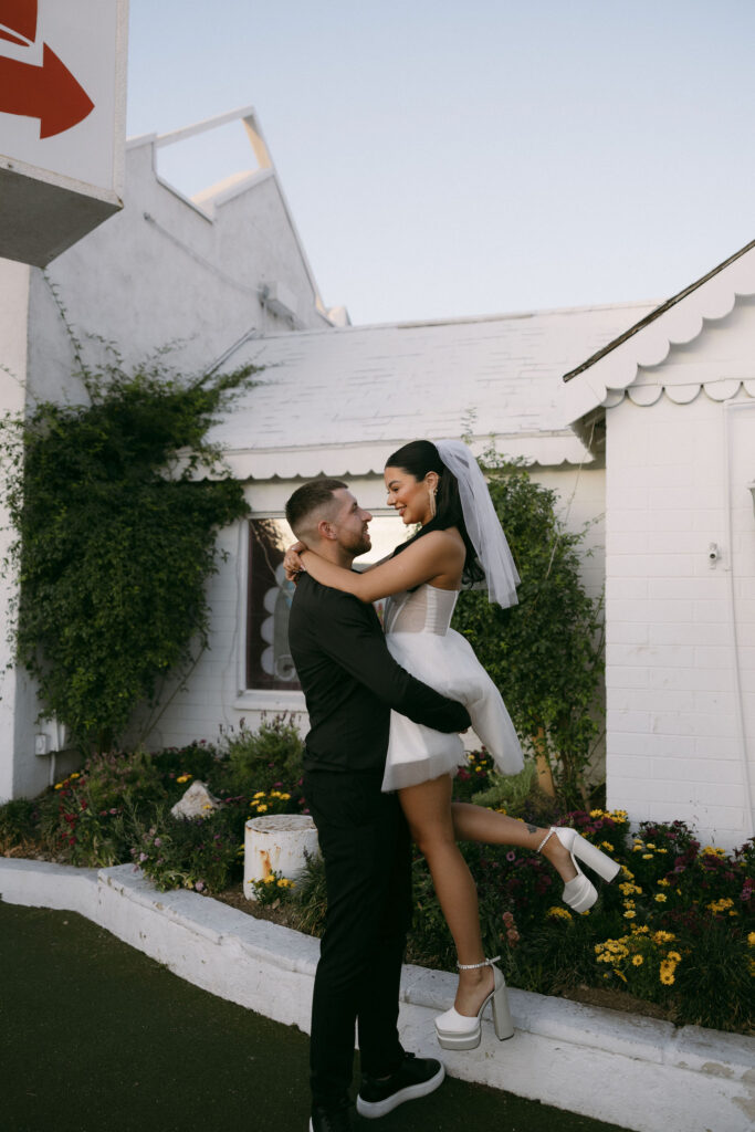 Groom picking up his bride during their elopement