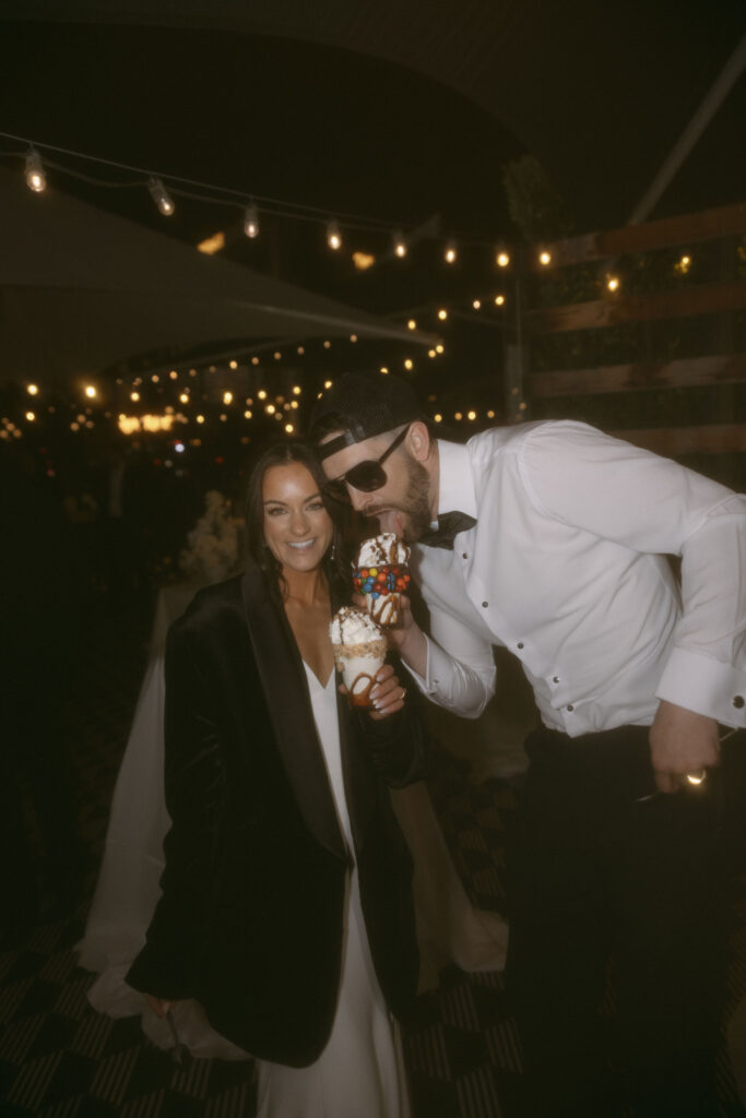 Bride and groom eating CrazyShakes during their Venetian Las Vegas wedding reception at Black Tap